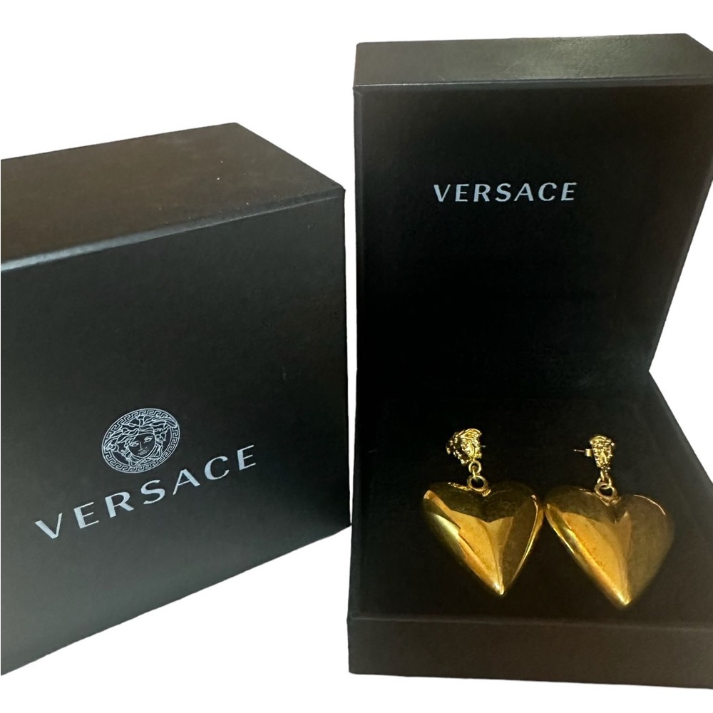 Versace Medusa heart pendant earrings.
Signature carved Medusa
